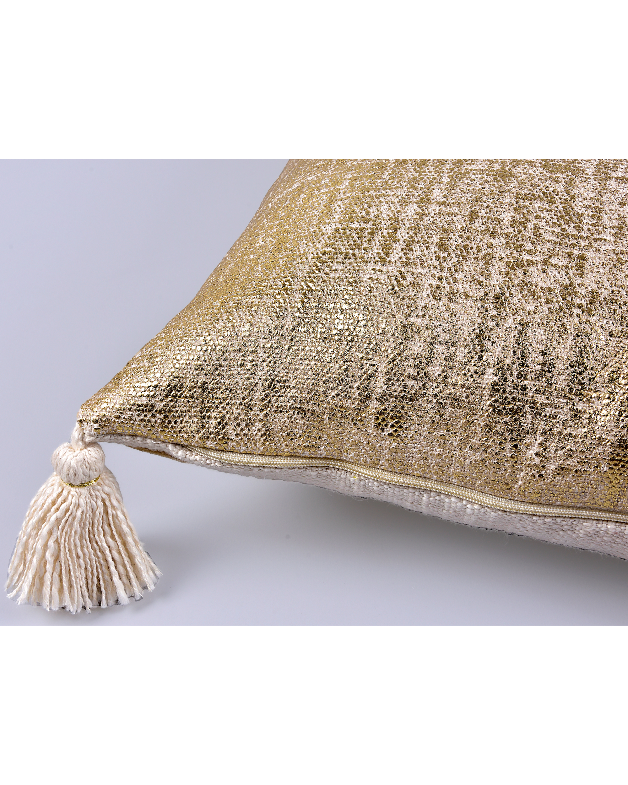 Cream and gold tasseled cushion cover by Skyy Living The Secret Label